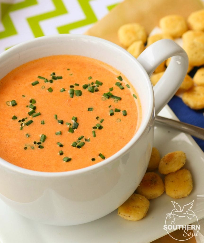 Homemade tomato soup with roasted onions and garlic is an easy to make recipe that is totally addictive. After one bite you'll never buy the canned stuff again!