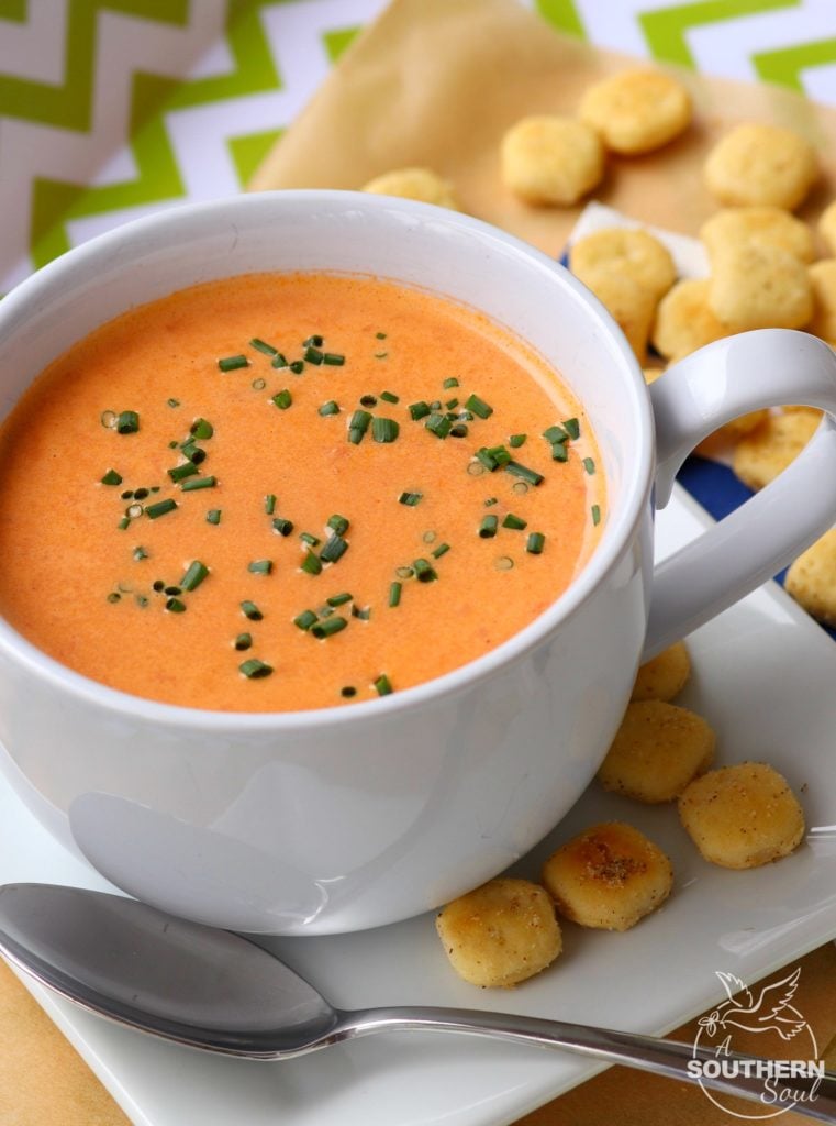 Homemade tomato soup with roasted onions and garlic is an easy to make recipe that is totally addictive. After one bite you'll never buy the canned stuff again!