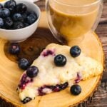 Blueberry Lemon Scone served with fresh berries and coffee.