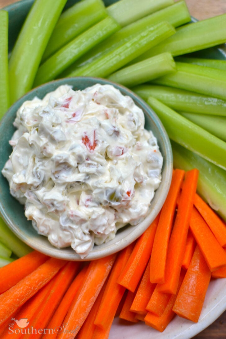 Cream cheese and olive spread with carrots and celert.