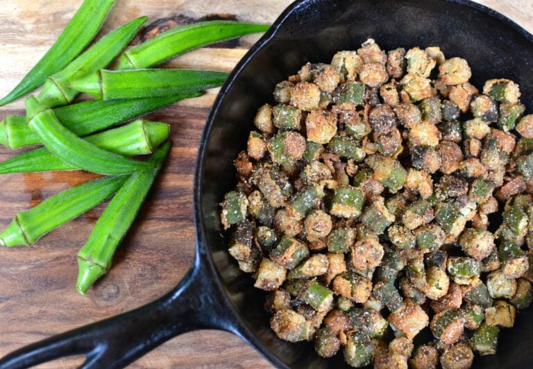Crispy Fried Okra: A Southern Staple Made Simple in cast iron skillet with fresh okra pods on wooden board