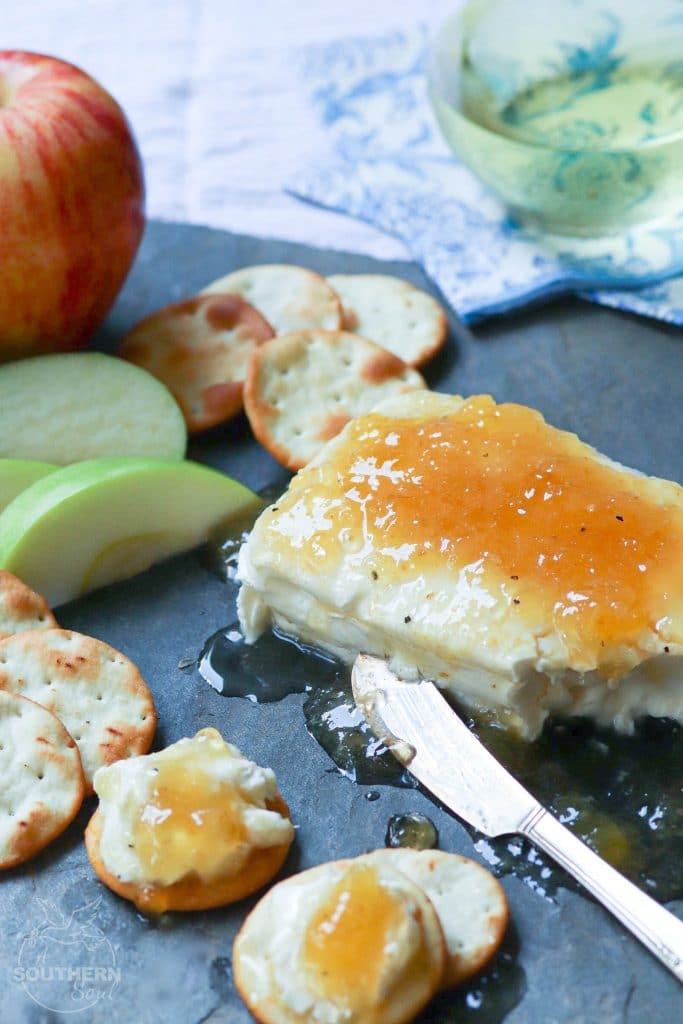 Jezebel Sauce made with pineapple preserves, apple jelly, horseradish, dry mustard and pepper is delicious as an appetizer or sauce for meat.