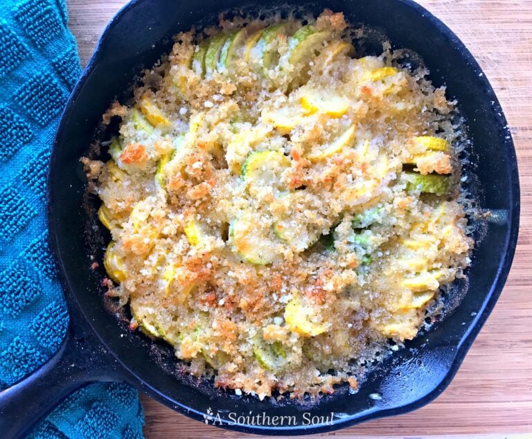 Zucchini Squash Casserole with Crispy Topping baked in cast iron skillet with golden breadcrumb crust