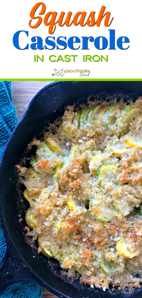 Squash casserole in cast iron skillet with cheese.