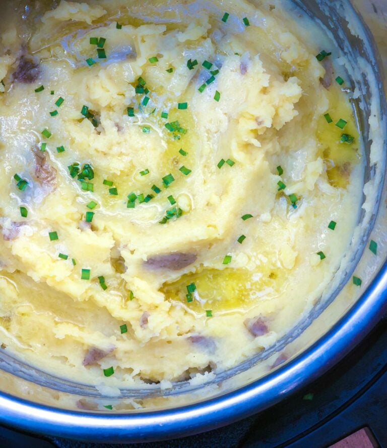 Instant Pot Mashed Potatoes are easy to make thanks to pressure cooking. Flavored with butter and perfect seasoning, they are great for a weeknight meal or the holidays.
