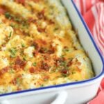 Twice baked potato casserole is a family favorite recipe. Loaded with bacon and cheese, it's a great side dish for the holidays or a week night meal.