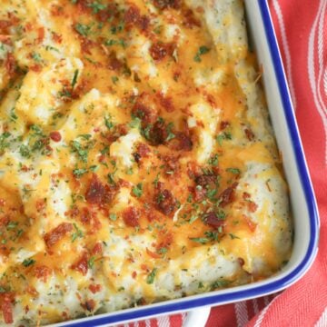 Twice baked potato casserole is a family favorite recipe. Loaded with bacon and cheese, it's a great side dish for the holidays or a week night meal.