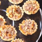 Pecan Pie Tart Bites are a fun little treat loaded with all the flavor of a regular slice of pie! Easy to make with the help of store bought phyllo cups, this dessert comes together in less than 15 minutes.