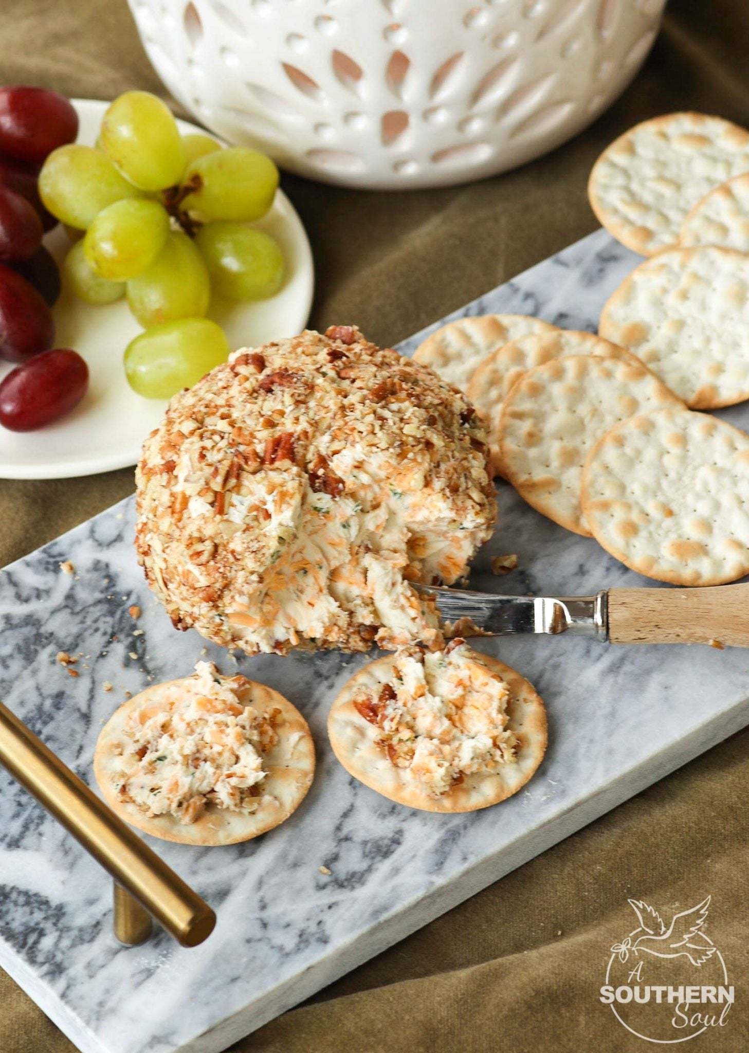 Cheddar & Chive Ball is an easy to make appetizer that's perfect for any gathering. It freezes beautifully so that you've throw a party at the drop of a hat!