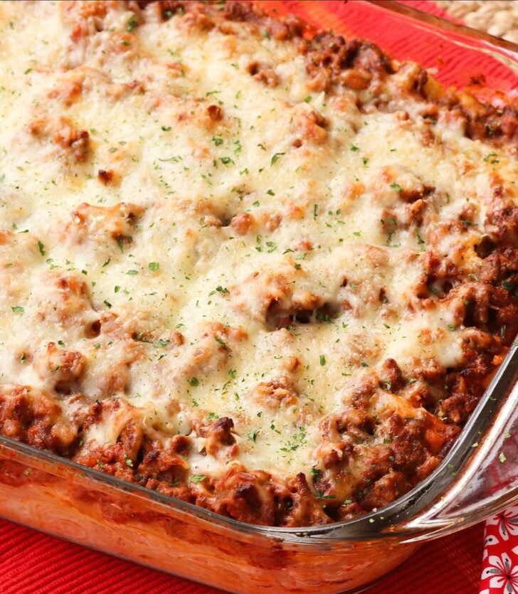 Out Of This World Baked Spaghetti in a baking dished topped with mozzarella cheese.