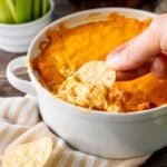 Buffalo chicken Dip with dipped tortilla chip.