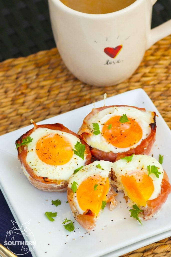 Ham and Cheese Egg Cups made in a muffin tin are a low carb breakfast that downright delicious. They are super easy to make with three ingredients are are ready to enjoy in less than 20 minutes.