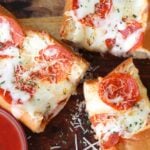 Meat Lovers Stuffed French Bread Pizza is easy to make and loaded with flavor. Hamburger and pepperoni along with two kinds of gooey cheese make this a recipe perfect for a weeknight meal or for game day!