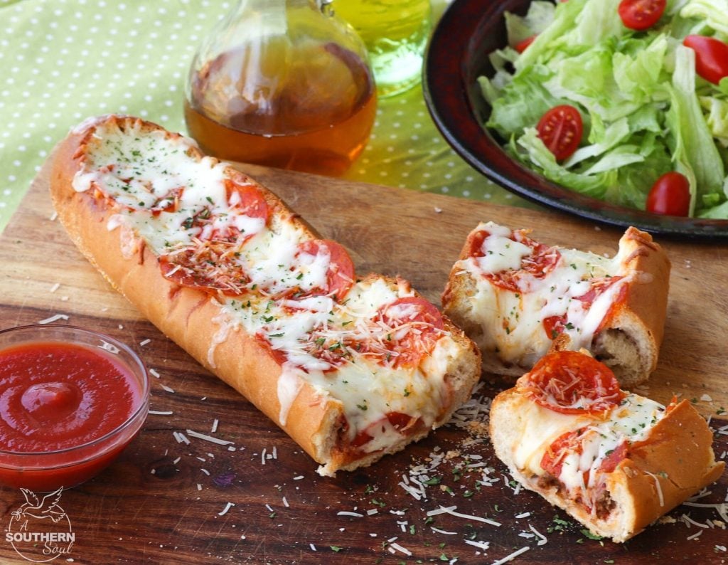 Meat Lovers Stuffed French Bread Pizza is easy to make and loaded with flavor. Hamburger and pepperoni along with two kinds of gooey cheese make this a recipe perfect for a weeknight meal or for game day!