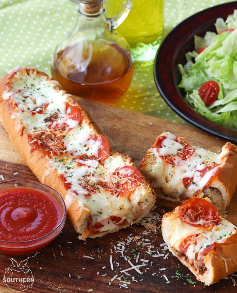 Meat Lovers Stuffed French Bread Pizza is easy to make and loaded with flavor. Hamburger and pepperoni along with two kinds of gooey cheese make this a recipe perfect for a weeknight meal or for game day!