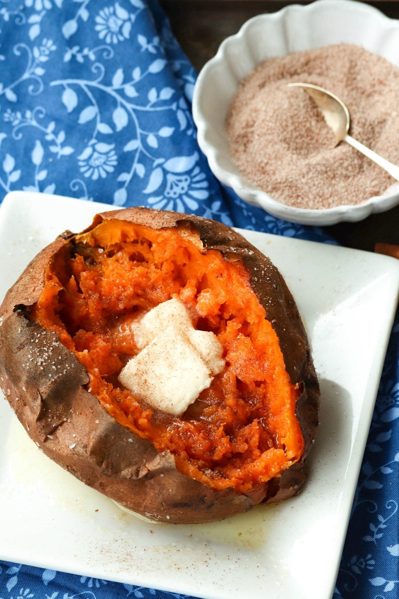 Sweet Potatoes cooked perfectly in the Air Fryer then seasoned with salt and cinnamon sugar along with butter is an amazing easy to make side dish.