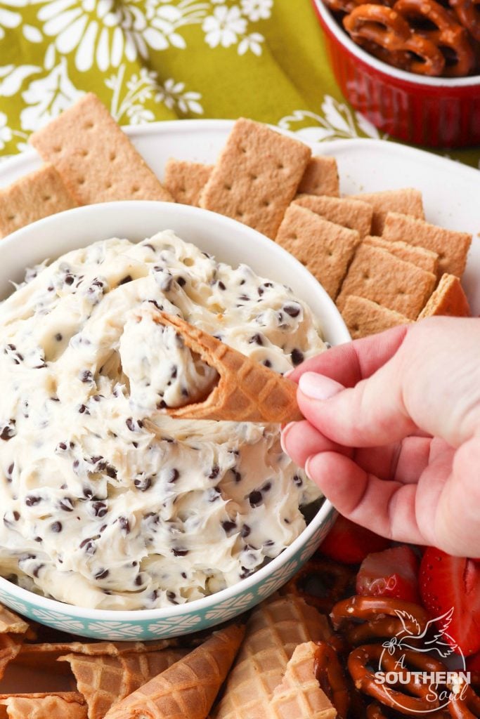 Chocolate Chips mixed with cream cheese, sugar and vanilla create a dip that tastes like a slice of bakery cheesecake! Serve with fresh fruit, pretzels, and cookies for a sweet treat everyone will love.