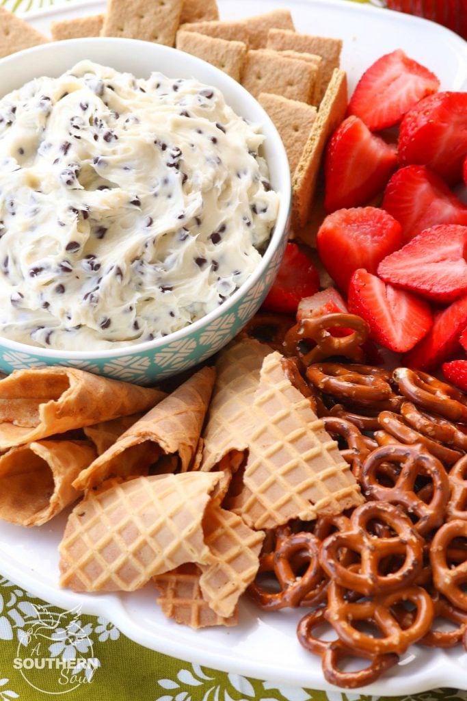 Chocolate Chips mixed with cream cheese, sugar and vanilla create a dip that tastes like a slice of bakery cheesecake! Serve with fresh fruit, pretzels, and cookies for a sweet treat everyone will love.
