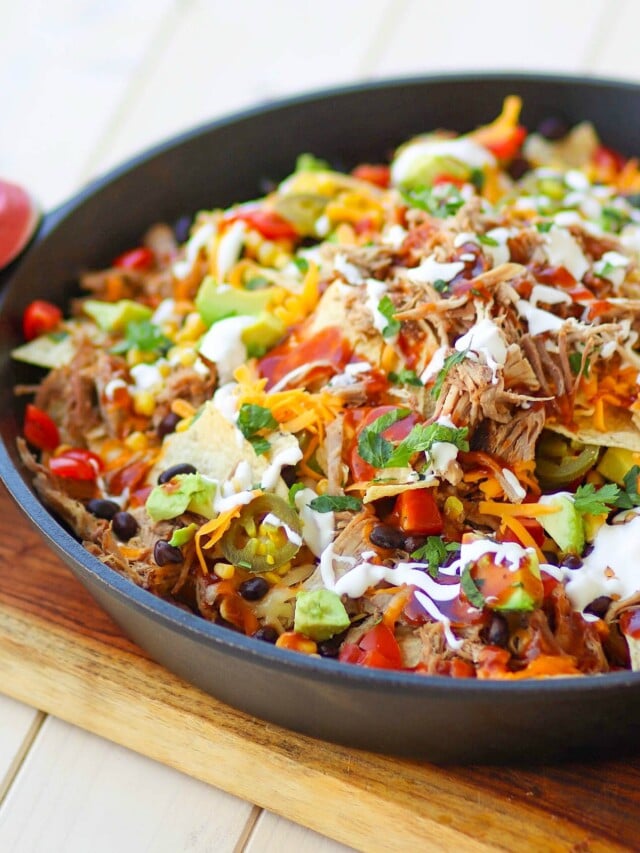 Pulled Pork Ultimate Nachos in a cast iron skillet