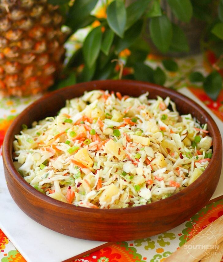 Pineapple Slaw is made with pineapple chunks, bagged cabbage, sliced almonds and green onions with a light, sweet dressing is a side dish that is great for any occasion!