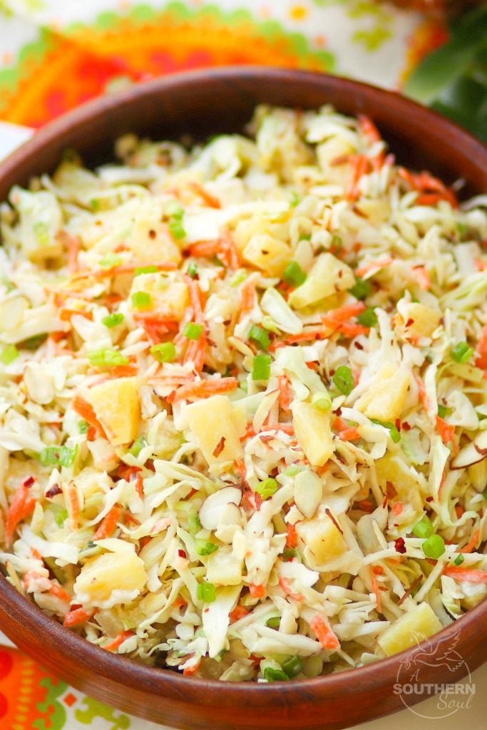 Pineapple Slaw is made with pineapple chunks, bagged cabbage, sliced almonds and green onions with a light, sweet dressing is a side dish that is great for any occasion!