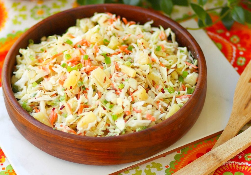 Pineapple Slaw is made with pineapple chunks, bagged cabbage, sliced almonds and green onions with a light, sweet dressing is a side dish that is great for any occasion!