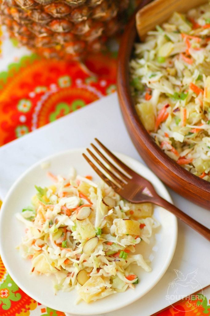 Pineapple Slaw is made with pineapple chunks, bagged cabbage, sliced almonds and green onions with a light, sweet dressing is a side dish that is great for any occasion!