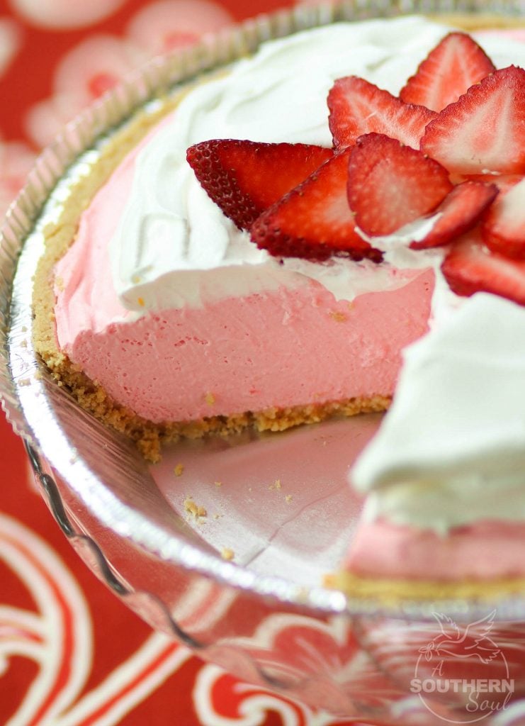 Strawberry Cream Pie made with fresh whipped cream and strawberry jello is an easy to make dessert that is cool and delicious. It's perfect for the holidays, potluck or covered dish suppers or a weeknight meal.