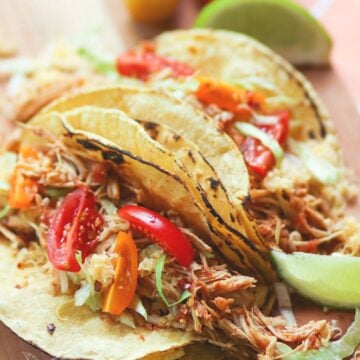 Shredded chicken cooked low and slow in the crock pot is flavored with taco seasoning and salsa. It's an easy to make recipe that great for tacos, nachos, burrito bowls and salads.