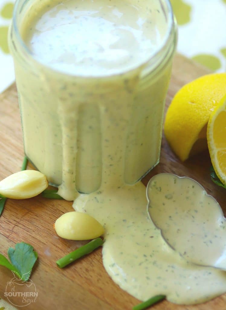 Green Goddess Dressing made with chives, parsley, garlic mayonnaise, sour cream and a few other ingredients is a classic recipe for salads, fish and pasta.
