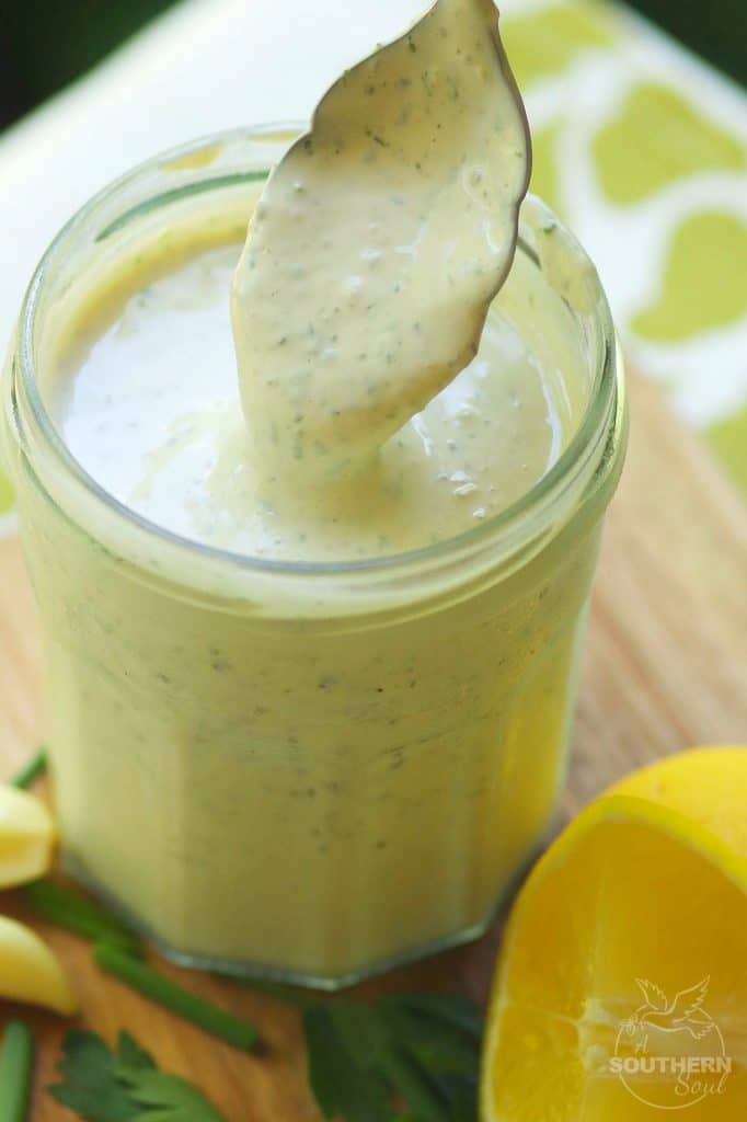 Green Goddess Dressing made with chives, parsley, garlic mayonnaise, sour cream and a few other ingredients is a classic recipe for salads, fish and pasta.