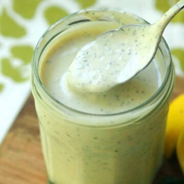 Green Goddess Dressing made with chives, parsley, garlic mayonnaise, sour cream and a few other ingredients is a classic recipe for salads, fish and pasta.