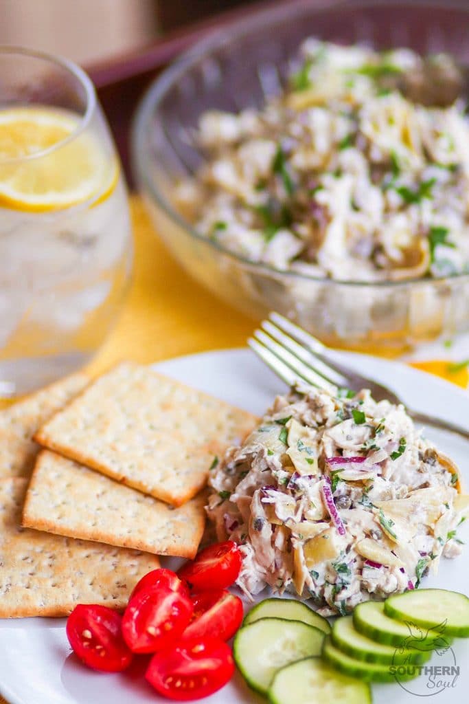 Artichoke Chicken Salad made with shredded white meat chicken, artichokes, capers and red onion tossed in a creamy, light, fresh dressing is a great new twist on a classic recipe!