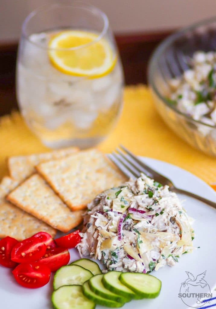 Artichoke Chicken Salad made with shredded white meat chicken, artichokes, capers and red onion tossed in a creamy, light, fresh dressing is a great new twist on a classic recipe!