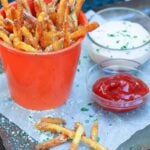 Store bought shoe string potatoes are fried to perfection with very little oil in the air fryer. They are tossed in garlic butter then sprinkled with salt, Parmesan cheese and parsley for a treat that is crazy good!