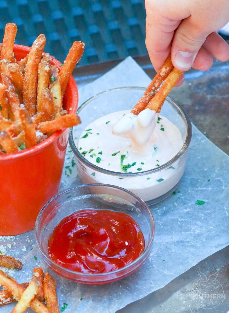 Store bought shoe string potatoes are fried to perfection with very little oil in the air fryer. They are tossed in garlic butter then sprinkled with salt, Parmesan cheese and parsley for a treat that is crazy good!