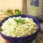 Rice made in the Instant Pot with garlic, fresh parsley and chives, along with butter is an easy to make side dish that turns out perfectly every time!