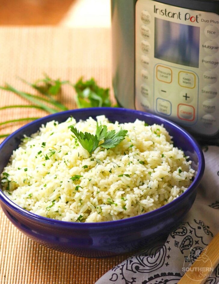 Rice made in the Instant Pot with garlic, fresh parsley and chives, along with butter is an easy to make side dish that turns out perfectly every time!