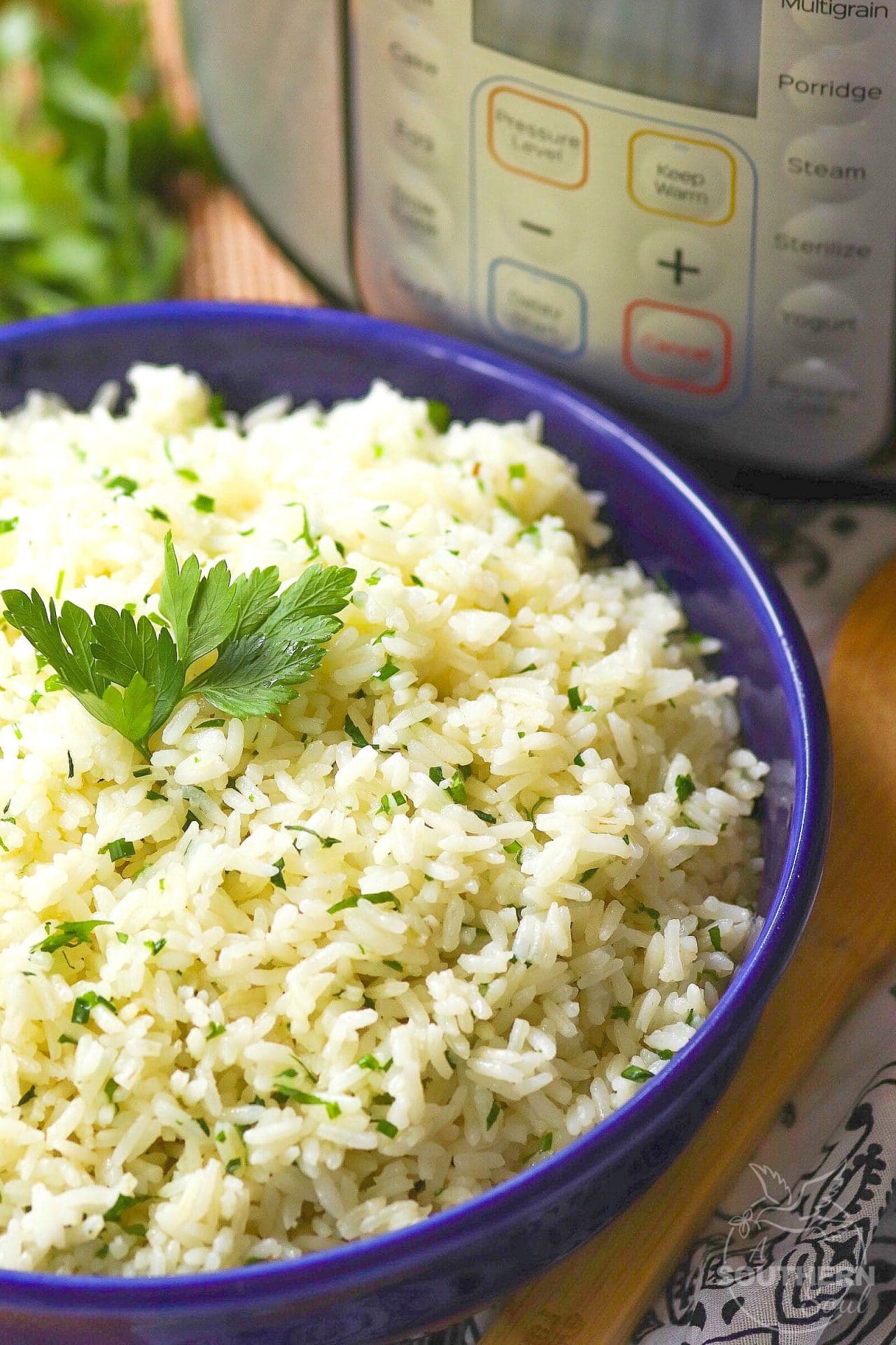 Rice made in the Instant Pot with garlic, fresh parsley and chives, along with butter is an easy to make side dish that turns out perfectly every time!