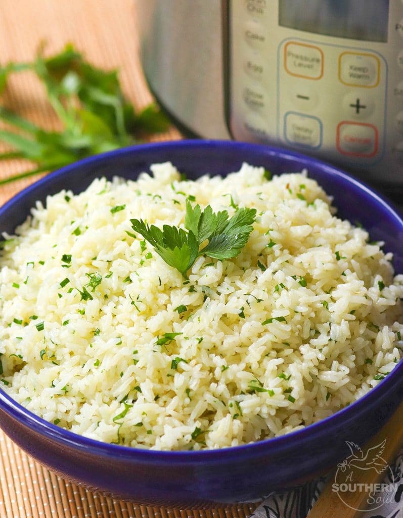 Rice made in the Instant Pot with garlic, fresh parsley and chives, along with butter is an easy to make side dish that turns out perfectly every time!