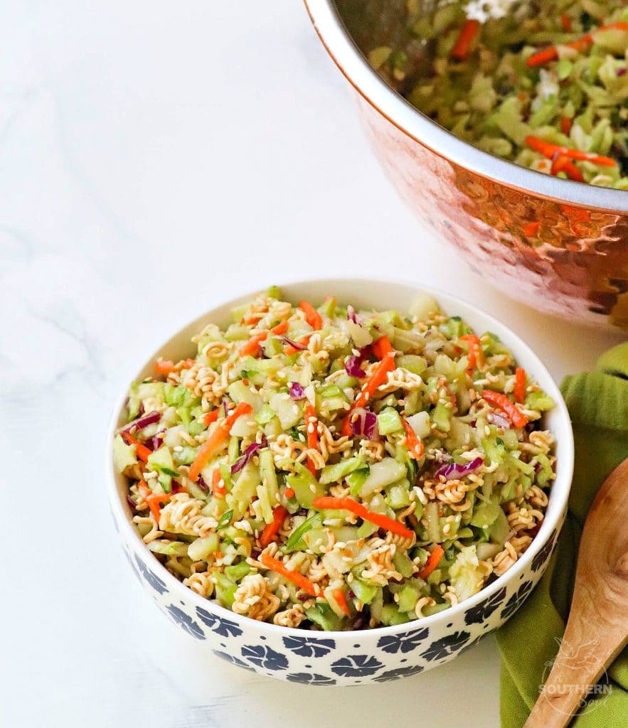Ramen Broccoli Slaw made with toasted, packaged noodles, broccoli, carrots, green onion and a savory sweet dressing is a delicious side dish. Perfect for a weeknight meal, cookout, pot luck or covered dish supper.