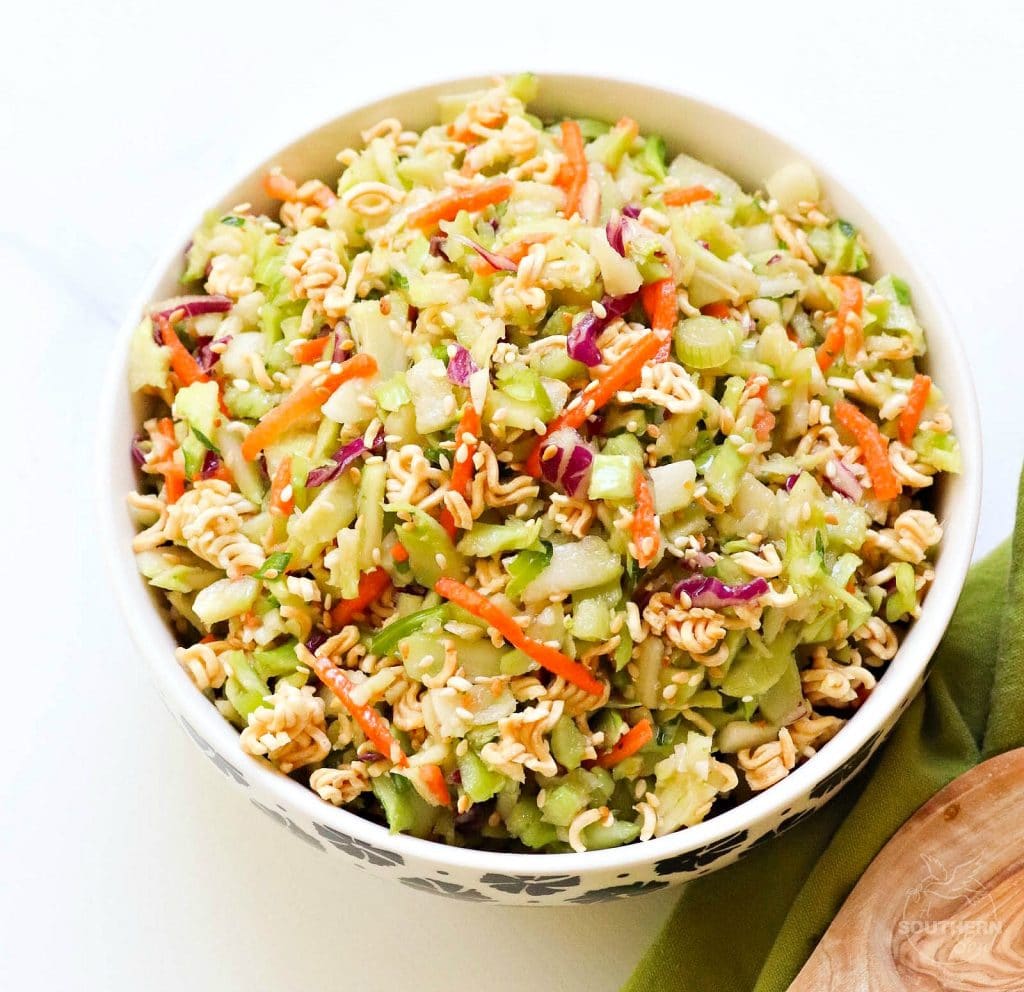 Ramen Broccoli Slaw made with toasted, packaged noodles, broccoli, carrots, green onion and a savory sweet dressing is a delicious side dish. Perfect for a weeknight meal, cookout, pot luck or covered dish supper.