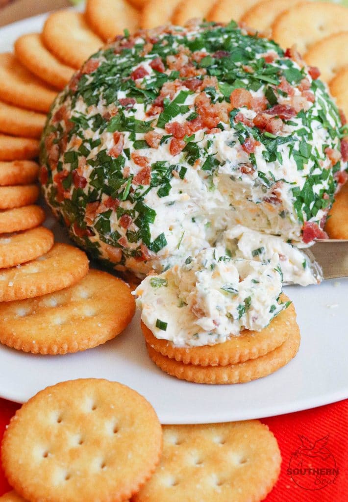Jalapeno Popper Cheese Ball made with cream cheese, jalapenos, cheddar cheese, ranch seasoning, bacon and chives is an easy to make crowd please appetizer!