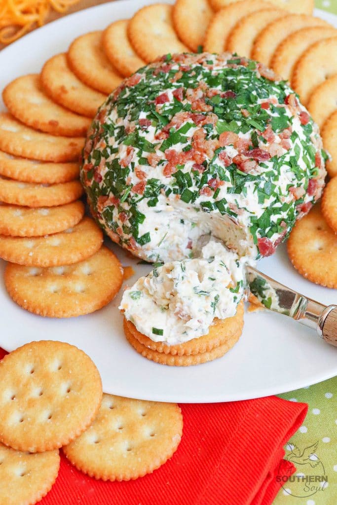 Jalapeno Popper Cheese Ball made with cream cheese, jalapenos, cheddar cheese, ranch seasoning, bacon and chives is an easy to make crowd please appetizer!