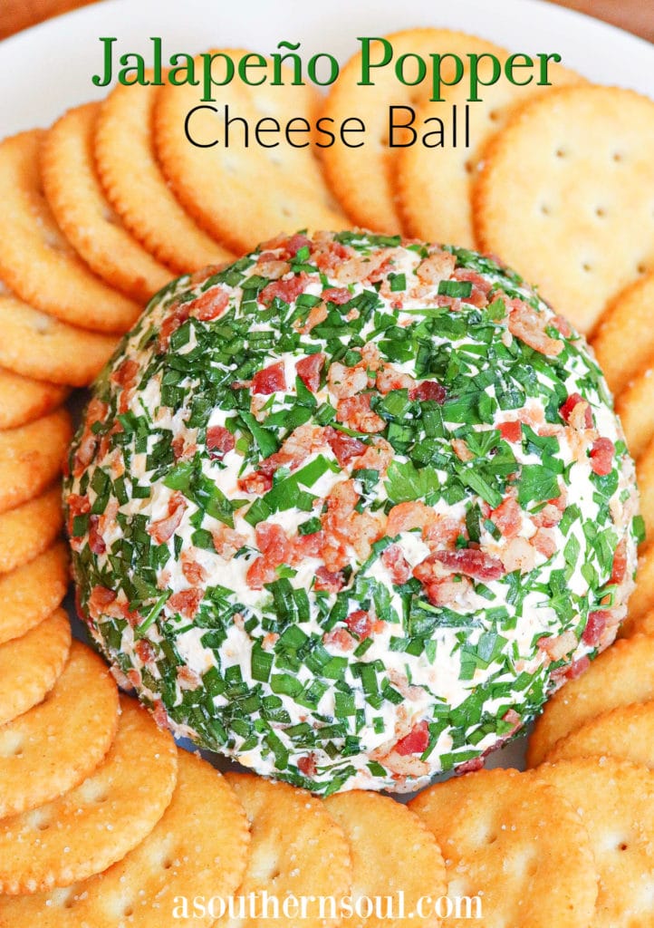 Jalapeno Popper Cheese Ball made with cream cheese, jalapenos, cheddar cheese, ranch seasoning, bacon and chives is an easy to make crowd please appetizer!