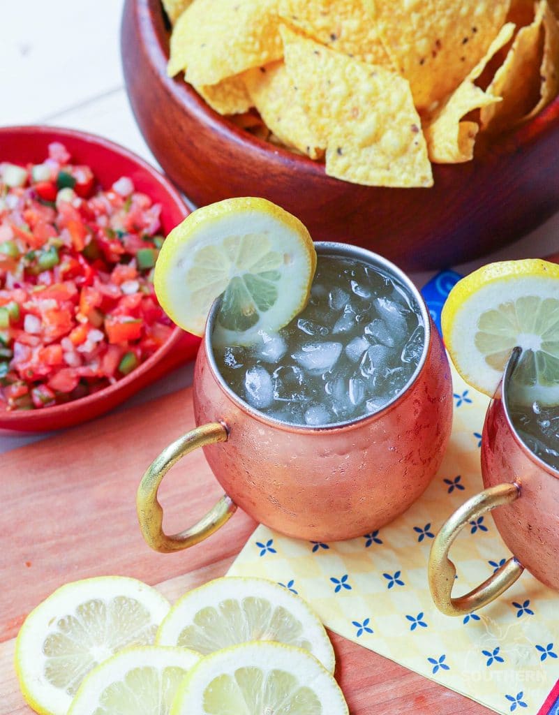 Refreshing lemon shandy made with your favorite beer, lemonade and a twist of lemon is a great drink for summer, tailgating, game day or backyard cookouts.