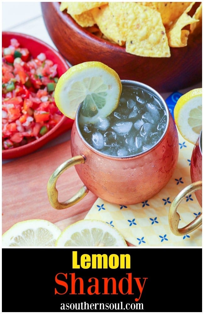 Refreshing lemon shandy made with your favorite beer, lemonade and a twist of lemon is a great drink for summer, tailgating, game day or backyard cookouts.