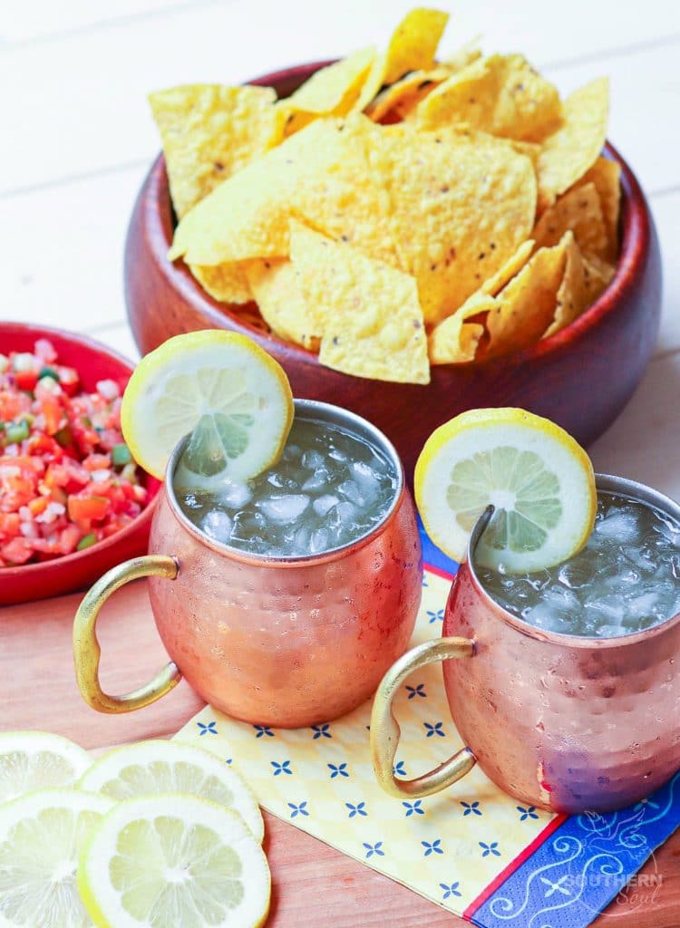 Refreshing lemon shandy made with your favorite beer, lemonade and a twist of lemon is a great drink for summer, tailgating, game day or backyard cookouts.