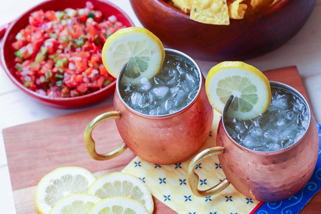 Refreshing lemon shandy made with your favorite beer, lemonade and a twist of lemon is a great drink for summer, tailgating, game day or backyard cookouts.