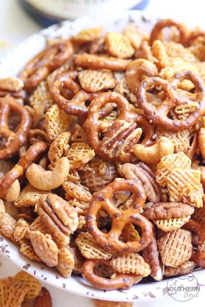 Sweet and Nutty Snack Mix made with brown sugar, butter and corn syrup, them baked until golden brown is a snack that's totally irresistible!